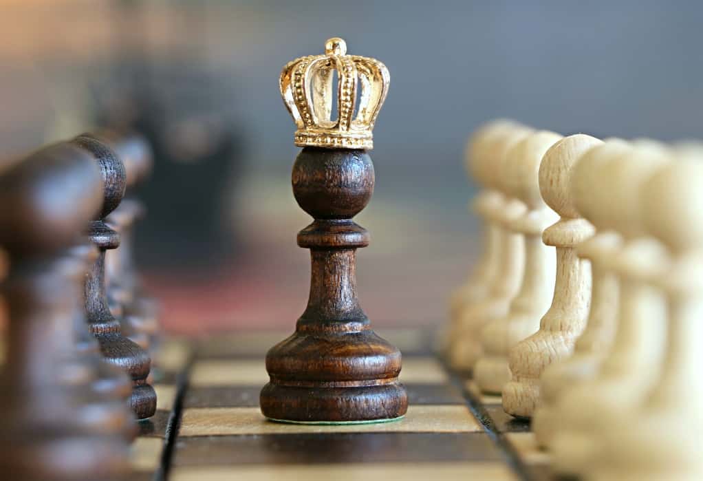 Chess pawn with a king's crown. With a solid digital marketing strategy, small businesses can defeat larger opponents.