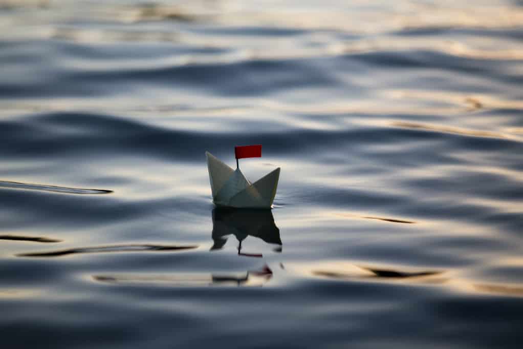 A digital marketing strategy can help small businesses stay afloat, like this small paper boat floating in water