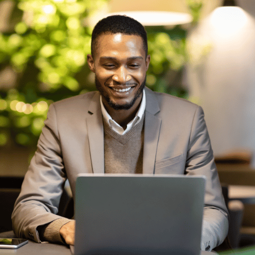 A person interacts with a futuristic interface displaying business metrics like marketing, production, and team goals.